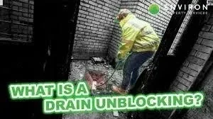 Worker preparing to enter a confined drainage space, showcasing safety regulations in action